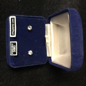 Cubic zirconia earrings; 14k white gold posts.